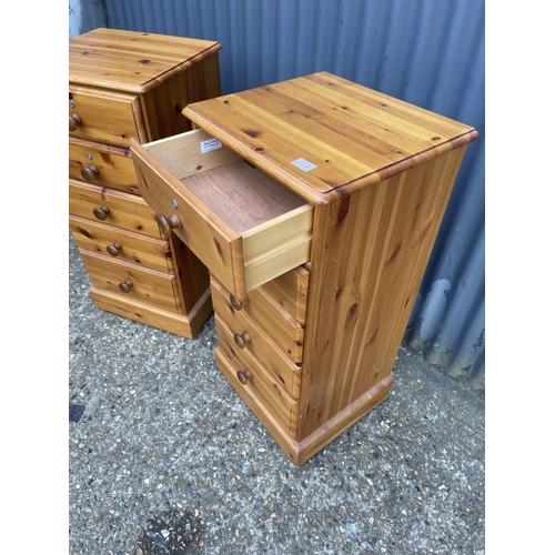 173 - A pair of pine tallboy chests of five drawers