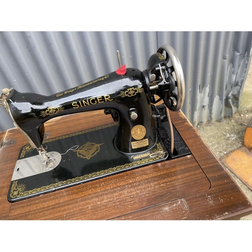 185 - A singer cabinet sewing machine