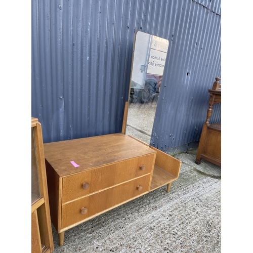 20 - A mid century light oak bookcase together with a similar style mid century two drawer dressing table