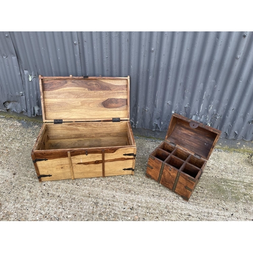 203 - A fruitwood blanket box trunk together with a hardwood 6 bottle wine casket