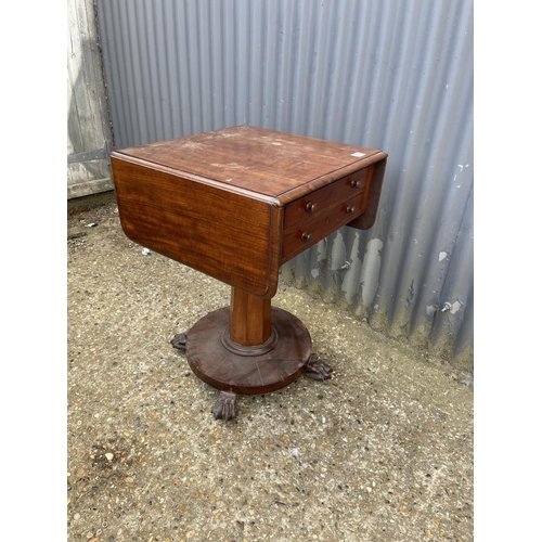 215 - A victorian drop leaf pedestal work table with two drawers and two dummy drawers