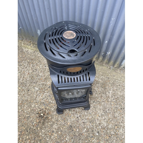 216 - A Provence cast iron calor gas heater with bottle. Used but working order. When obtainable new cost ... 