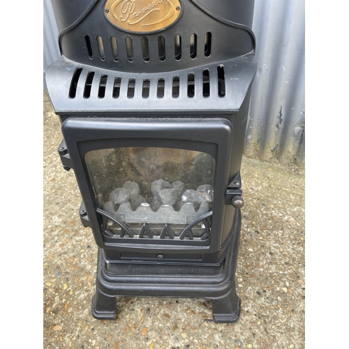 216 - A Provence cast iron calor gas heater with bottle. Used but working order. When obtainable new cost ... 