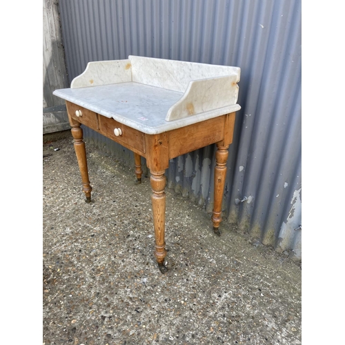 217 - A country pine washstand with white marble top 87x 50x90