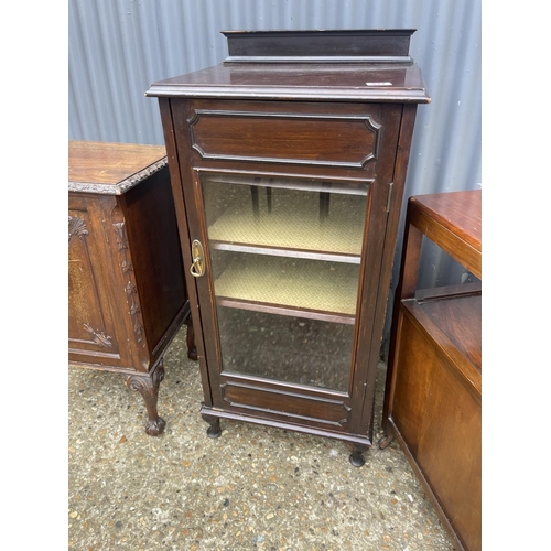 221 - A mahogany music cabinet, a mahogany bedside and a trolley / record cabinet