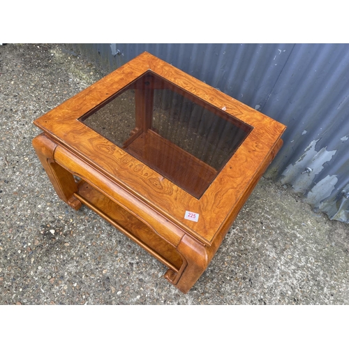 225 - An oriental style coffee table with drop in glass top