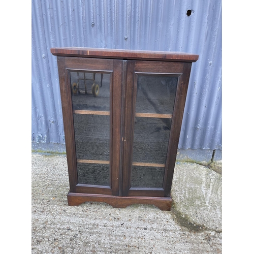 23 - A victorian rosewood two door glazed cabinet with adjustable shelves 66x36x95