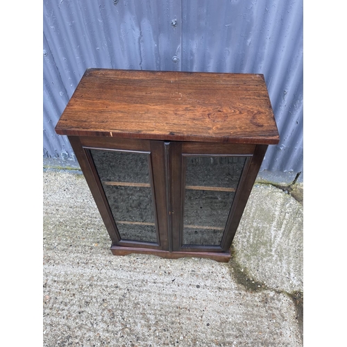 23 - A victorian rosewood two door glazed cabinet with adjustable shelves 66x36x95