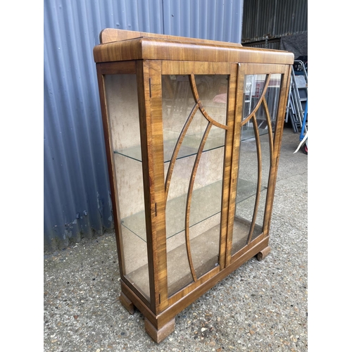 231 - A deco style walnut display cabinet with two glass shelves 90x30x122