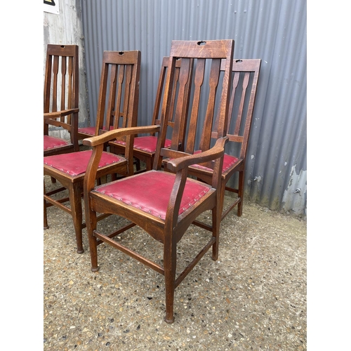 236 - A set of six arts and crafts period oak dining chairs (2 carvers)