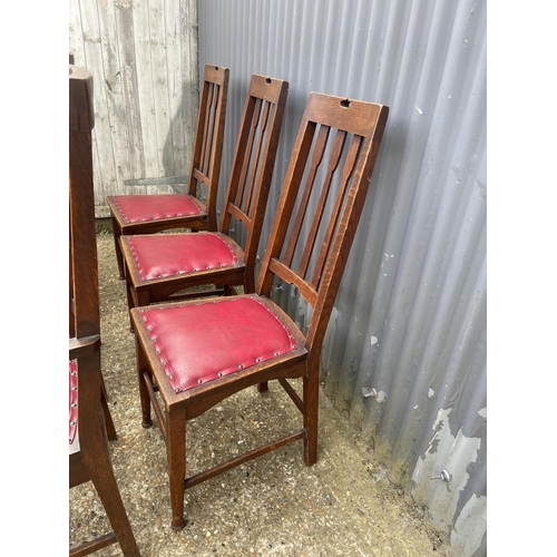 236 - A set of six arts and crafts period oak dining chairs (2 carvers)