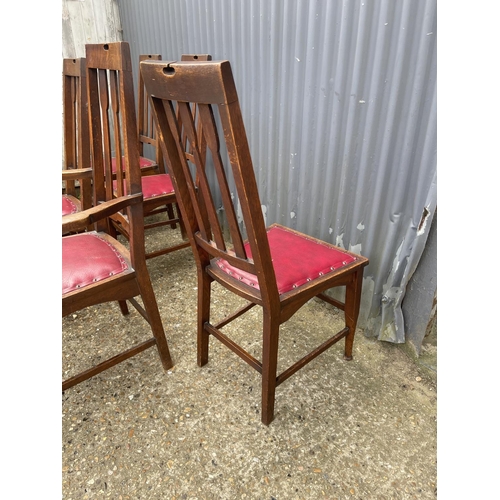 236 - A set of six arts and crafts period oak dining chairs (2 carvers)