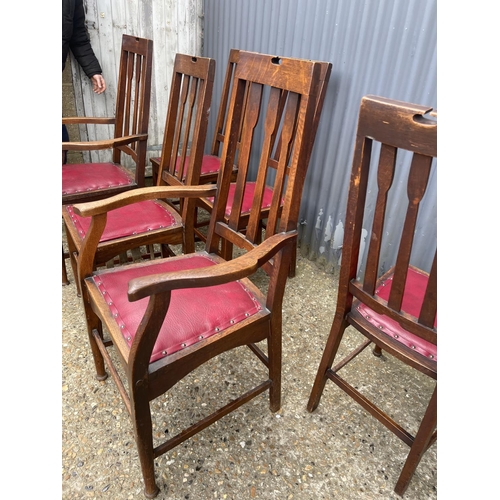 236 - A set of six arts and crafts period oak dining chairs (2 carvers)