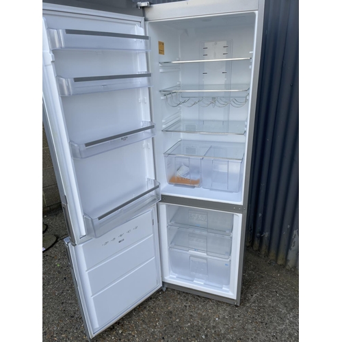 241 - A modern silver upright fridge freezer