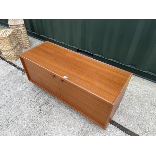 262 - A small teak two door sideboard / record cabinet by turnridge  122x45x 54