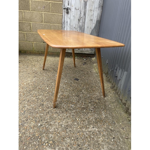 27 - An ercol light elm plank top kitchen table