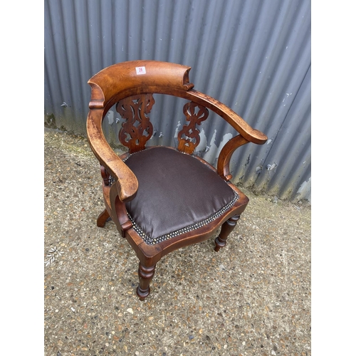 28 - A victorian smokers bow shaped elbow chair