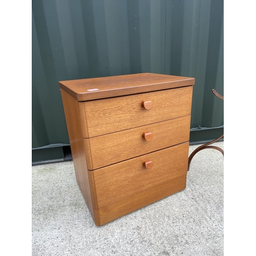 286 - A mid century teak chest of three together with a coat stand