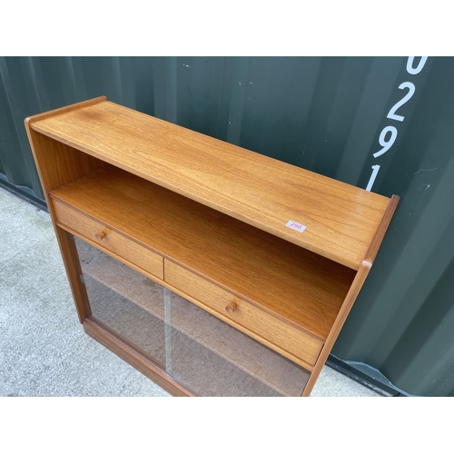 290 - A mid century teak bookcase with two drawers and glazed front 102x30x106