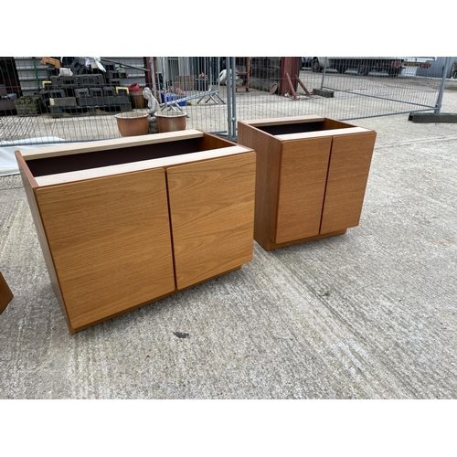 292 - A two section teak unit by SKOBY with a single teak top