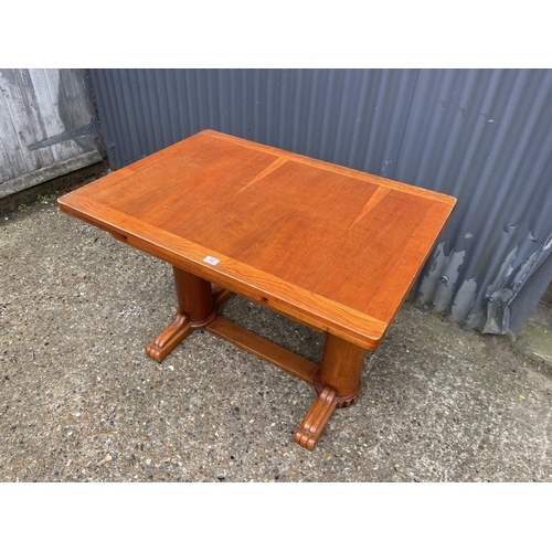 32 - A deco style oak drawer leaf dining table 105x75x75