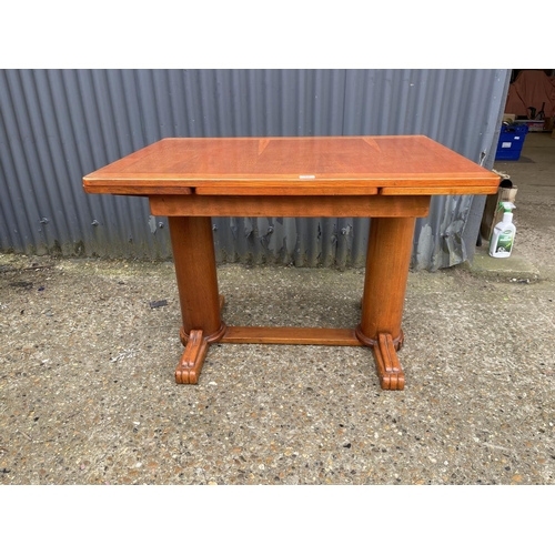 32 - A deco style oak drawer leaf dining table 105x75x75