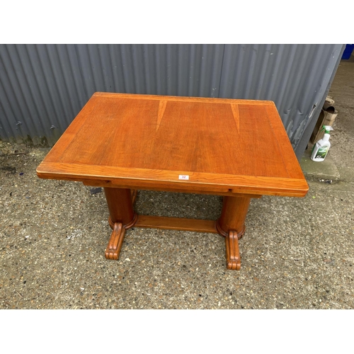 32 - A deco style oak drawer leaf dining table 105x75x75