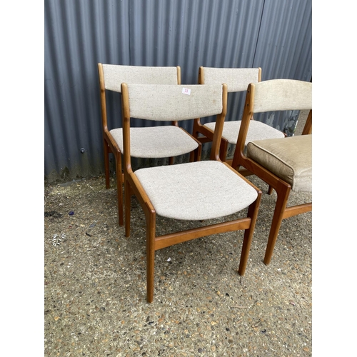 33 - A set of four danish style teak dining chairs (one with raised cushion seat)