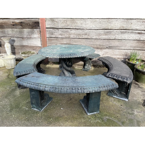 345 - A large green painted concrete garden table with ornate mermaid support together with four mermaid p... 