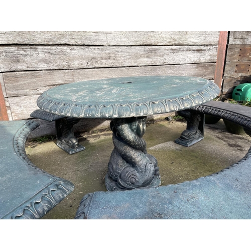 345 - A large green painted concrete garden table with ornate mermaid support together with four mermaid p... 