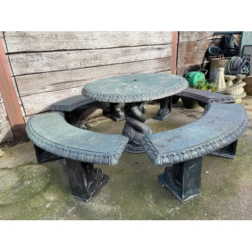 345 - A large green painted concrete garden table with ornate mermaid support together with four mermaid p... 