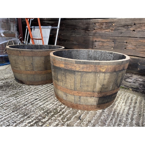 350 - A pair of Scottish oak half whisky barrel planters 2ft round