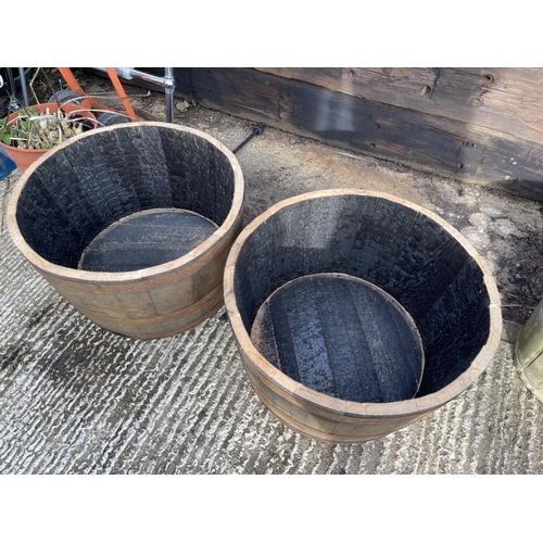 350 - A pair of Scottish oak half whisky barrel planters 2ft round