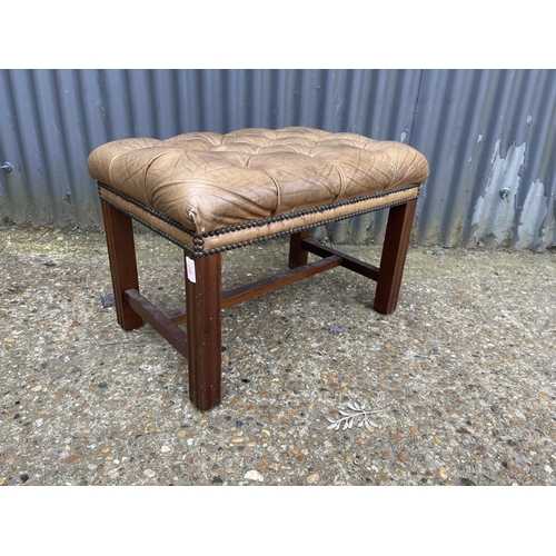 37 - A tan brown leather footstool