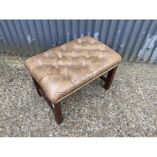 37 - A tan brown leather footstool