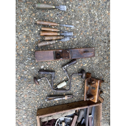 38 - An antique carpenters tool chest with assorted vintage tools including plan, chisels, axe and saws