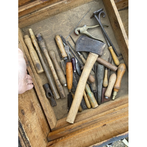 38 - An antique carpenters tool chest with assorted vintage tools including plan, chisels, axe and saws