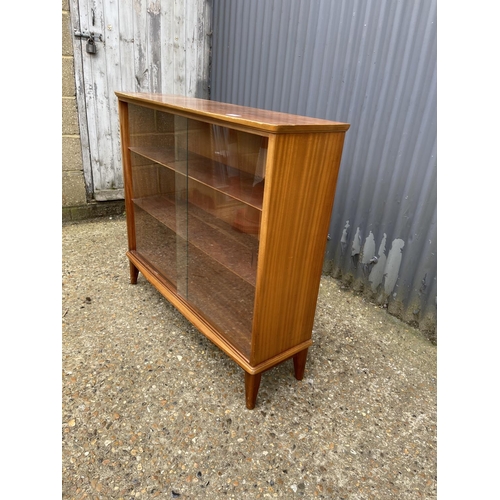 42 - A mid century glazed bookcase with adjustable shelves 99x28x88