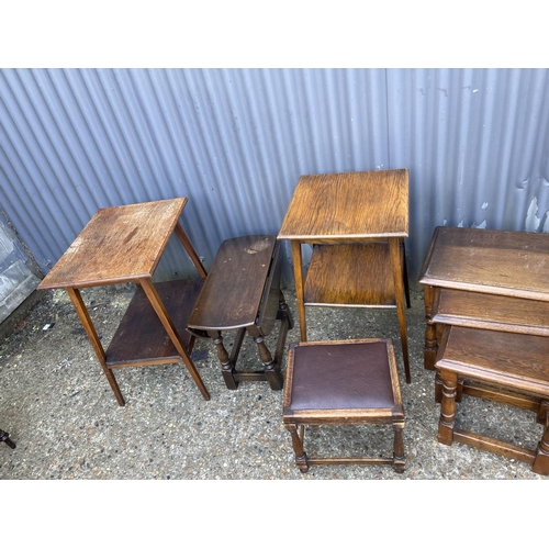 44 - AN  oak nest of three, two oak tables, stool and drop leaf table