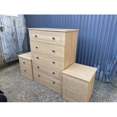 55 - A modern tallboy chest of five drawers together with a pair of matching bedsides