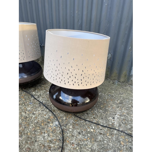 63 - A set of three modern brown pottery table lamps