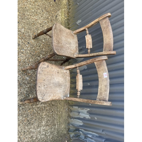 77 - A pair of Windsor style kitchen chairs