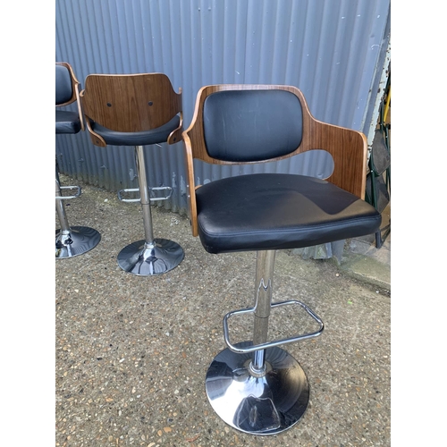 93 - 4 Eames style chrome and wood effect gas lift bar stools