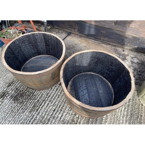 21 - A pair of scottish oak half wiskey barrell planters