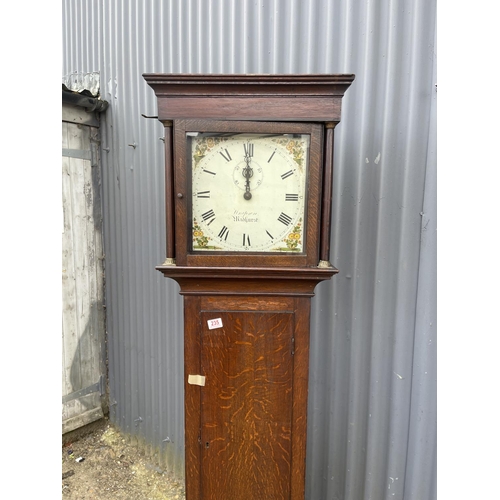 310 - An oak longcase clock by Midhurst maker (pendulum missing)