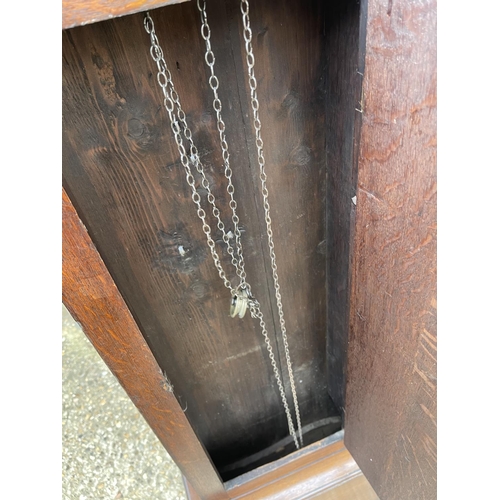 310 - An oak longcase clock by Midhurst maker (pendulum missing)