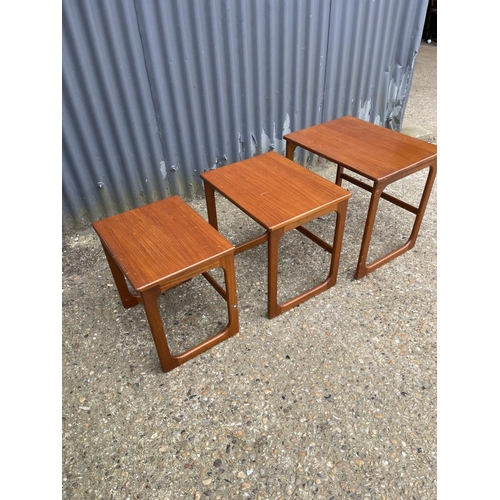 102 - A teak nest of three tables