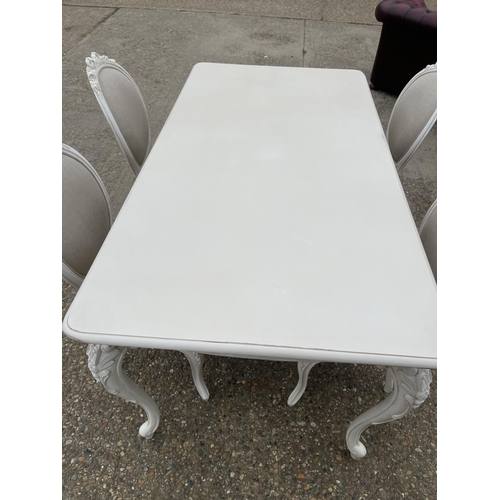 110 - A french style white painted dining table with four chairs 174x 94