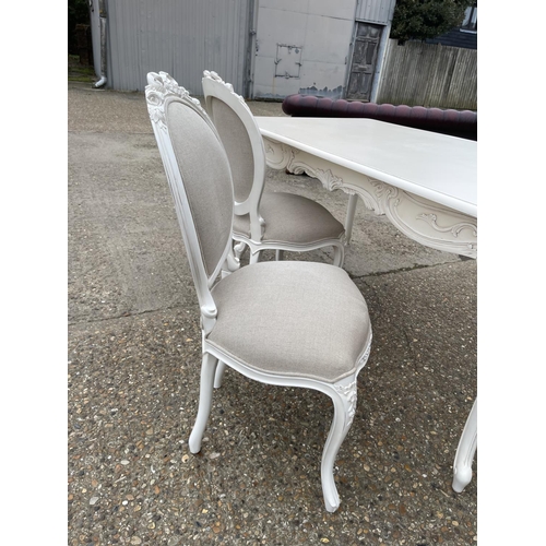 110 - A french style white painted dining table with four chairs 174x 94