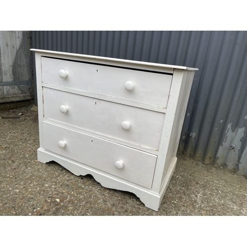 112 - A white painted pine chest of three drawers 92x54x 77